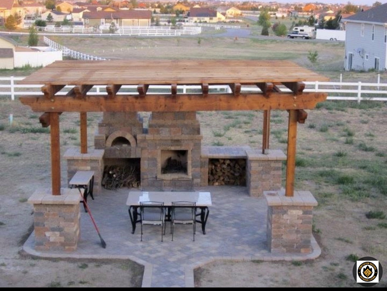 Timber pergola with stone fireplace