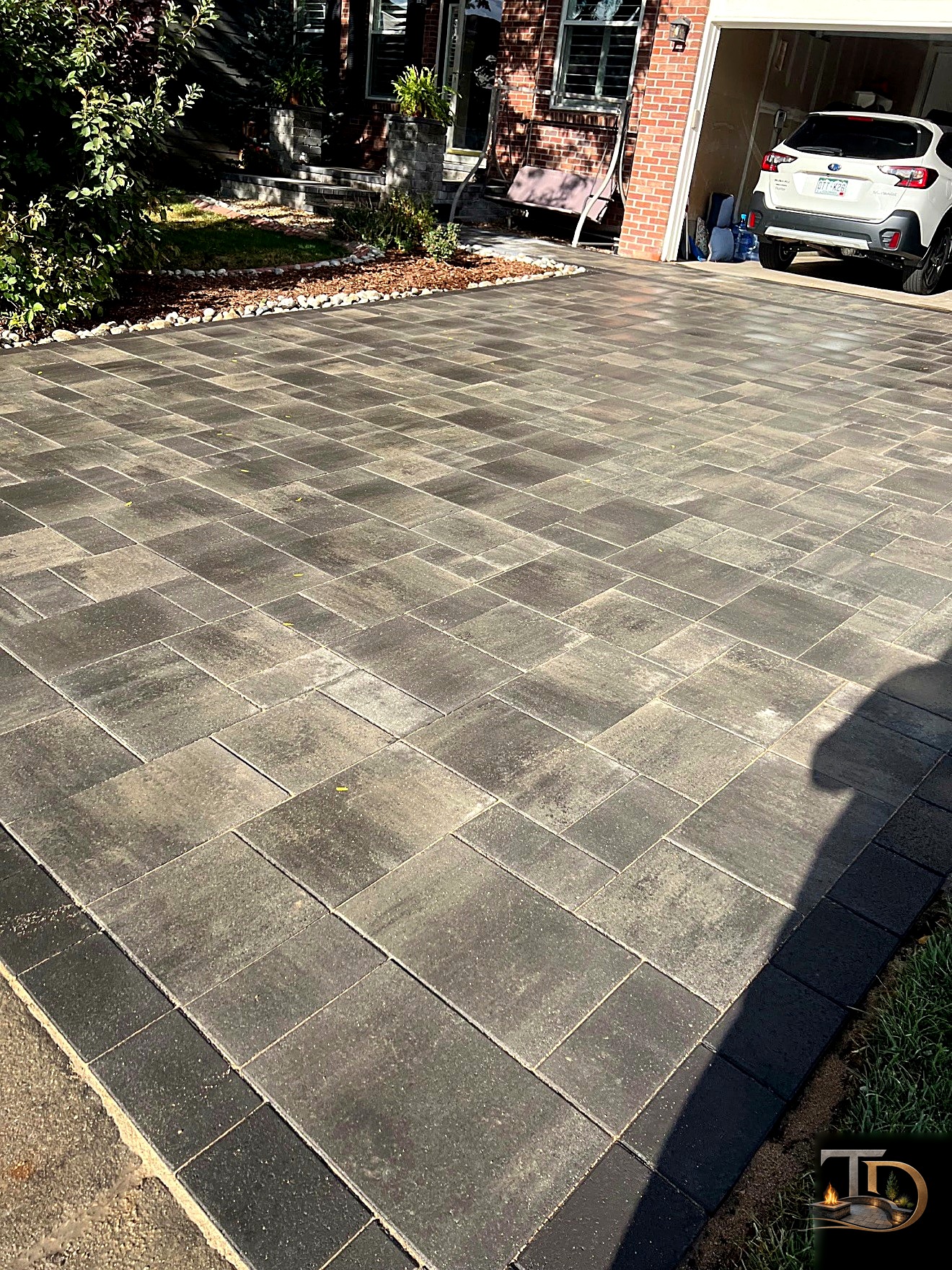 Custom paver driveway with contrasting border