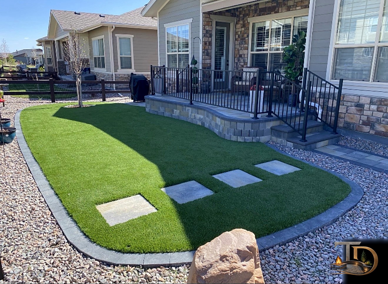 Artificial turf front lawn with paver step pads
