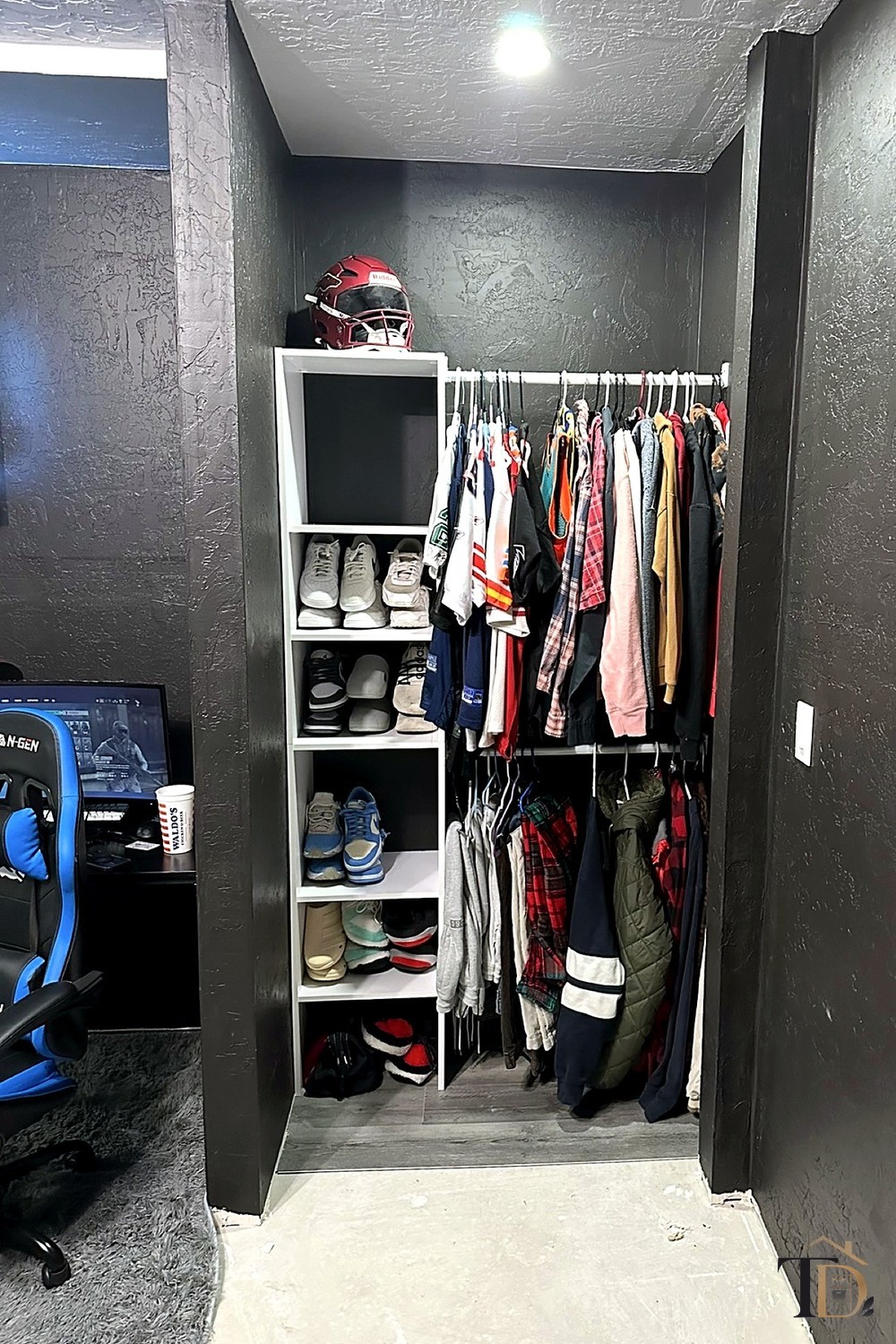A closet sorted into sections — shoes shelved in rows, clothes hung by category
